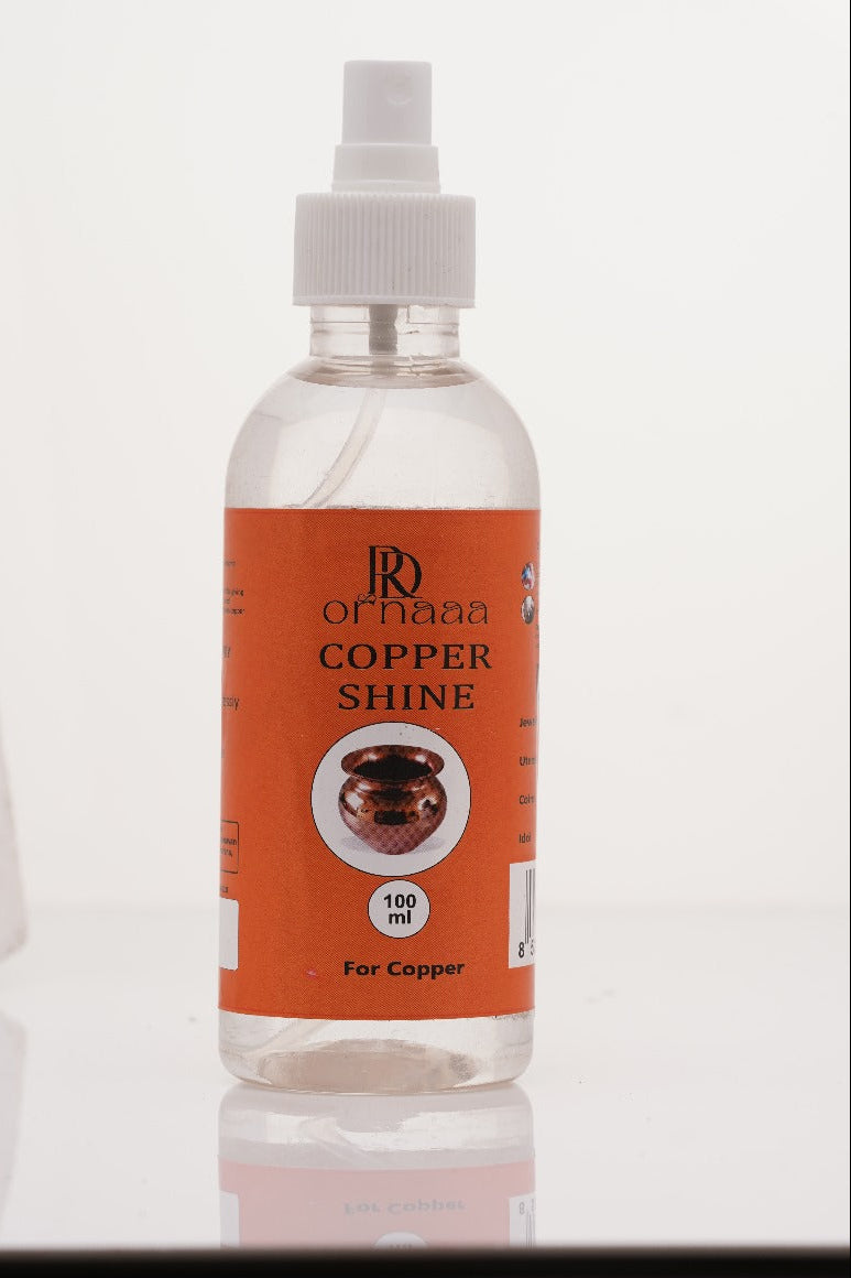 Bottle of 'Copper Shine' with an orange label on a white background